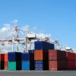 Port cranes and stacks of shipping containers