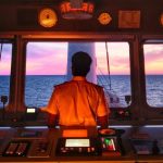 Anglo-Easter Univan Group Seafarer Standing At Bridge