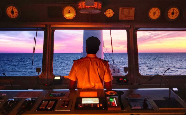 Anglo-Easter Univan Group Seafarer Standing At Bridge