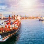 Container ship carrying container for business freight shipping import and export, Aerial view container ship arriving in commercial port.