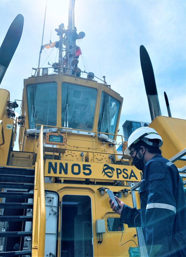 PSA Marine Engineering Officer updating BV surveyor over smart mobile device