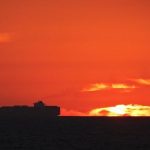silhouette sunset container ship