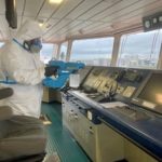 Specialist DisinfectYour.com team members on board a vessel