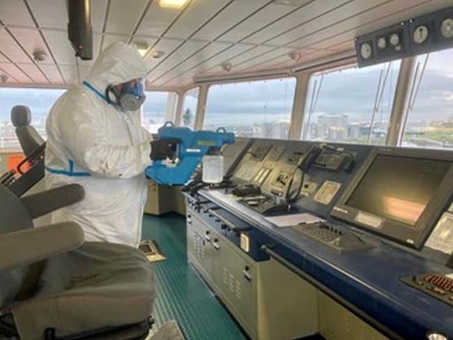 Specialist DisinfectYour.com team members on board a vessel