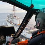 An MH-65 Dolphin helicopter crew based out of Air Station Kodiak and deployed aboard Cutter Alex Haley, prepares for a helicopter in-flight refueling at sea evolution with the cutter crew during a search and rescue case near Dutch Harbor, Alaska, Wednesday, Dec. 30, 2020. The crew hoisted an injured fisherman from the vessel Magnus Martens and placed him in the care of awaiting Guardian Flight Alaska personnel for further transport to Anchorage.