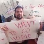 stranded seafarer for 18 months with board saying, "I want to go home"