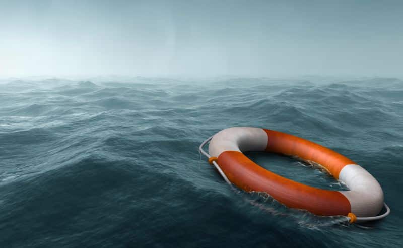 Lifebuoy floating in the vast expanse of sea