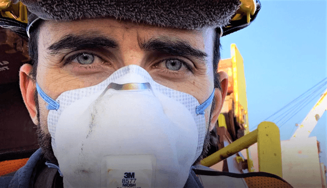Seafarer wearing PPE kit during COVID 19 pandemic onboard