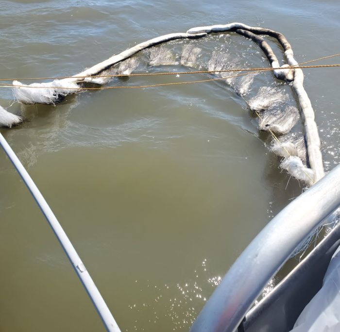 A close-up image of a sorbent boom outrigger used by response vessels to recover oil sheens in the vicinity of the Golden Ray wreck during Section Seven lifting operations on Monday