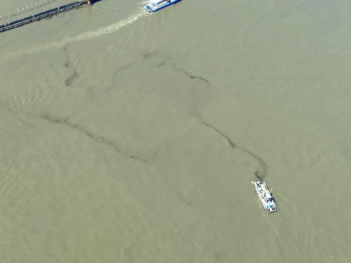 A skimmer vessel collects oil material during operations to lift Section Seven of the Golden Ray wreck on Monday. St. Simons Sound Incident response photo