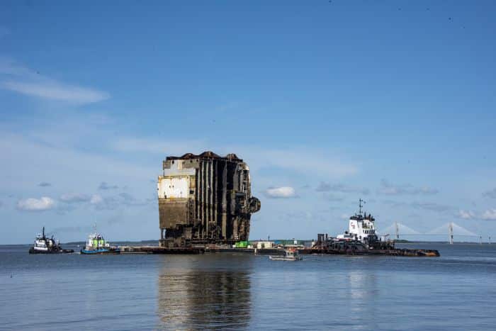 The Tug Kurt J. Crosby pushes the Barge 455-7 with Section Seven of the Golden Ray wreck to Mayors Point Terminal in Brunswick