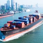 Large container ship arriving in port.