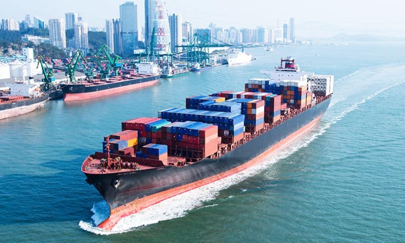 Large container ship arriving in port.