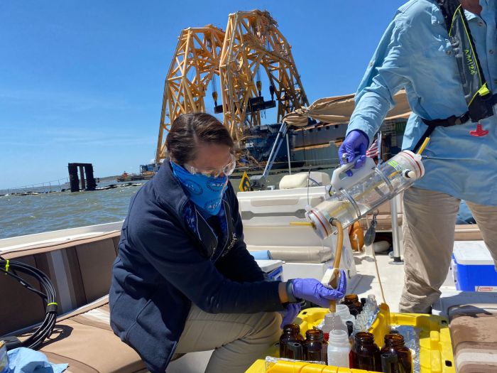 Response personnel collect water samples in the vicinity of the Golden Ray wreck on Saturday