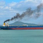 ship emitting black smoke