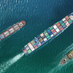 container ships sailing top down view