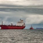 tanker ship anchored with grey skies above it