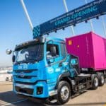 A zero-emissions truck drives on the replacement for the Gerald Desmond Bridge