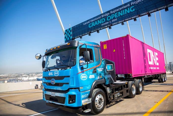 A zero-emissions truck drives on the replacement for the Gerald Desmond Bridge