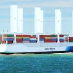 Large red cargo ship (tanker) sailing near Vlissingen, the Netherlands. Panoramic view. Freight transportation, fuel, power generation, logistics, industry, global communications, environmental damage