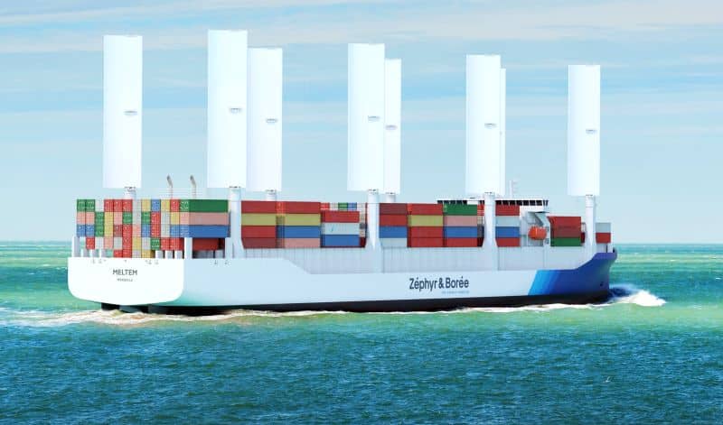Large red cargo ship (tanker) sailing near Vlissingen, the Netherlands. Panoramic view. Freight transportation, fuel, power generation, logistics, industry, global communications, environmental damage