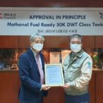 Seong Hun Kim, ABS Director, Korea Business Development presents the AIP to Tae-Hyun Koh, K Shipbuilding Chief Technology Officer