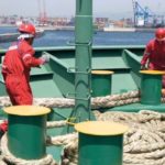 Seafarers working on deck
